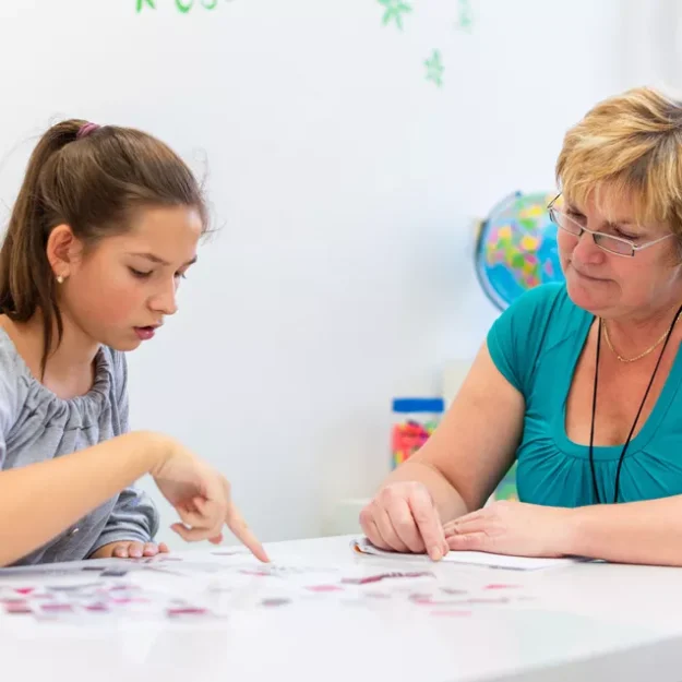 Teenager Working With Support Worker