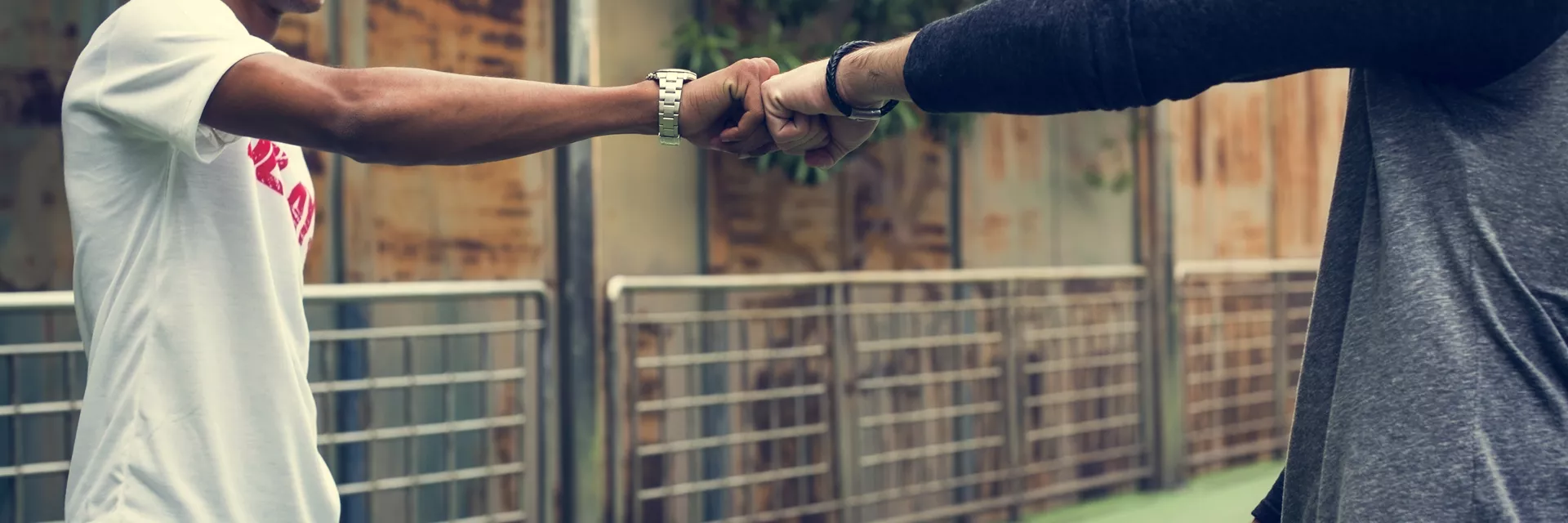 Two Guys Fist Bumping