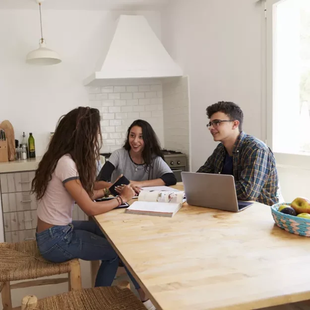 Young People Gathered In The Kitchen