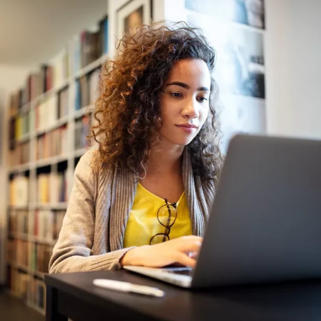 Young Person Studying On A Laptop